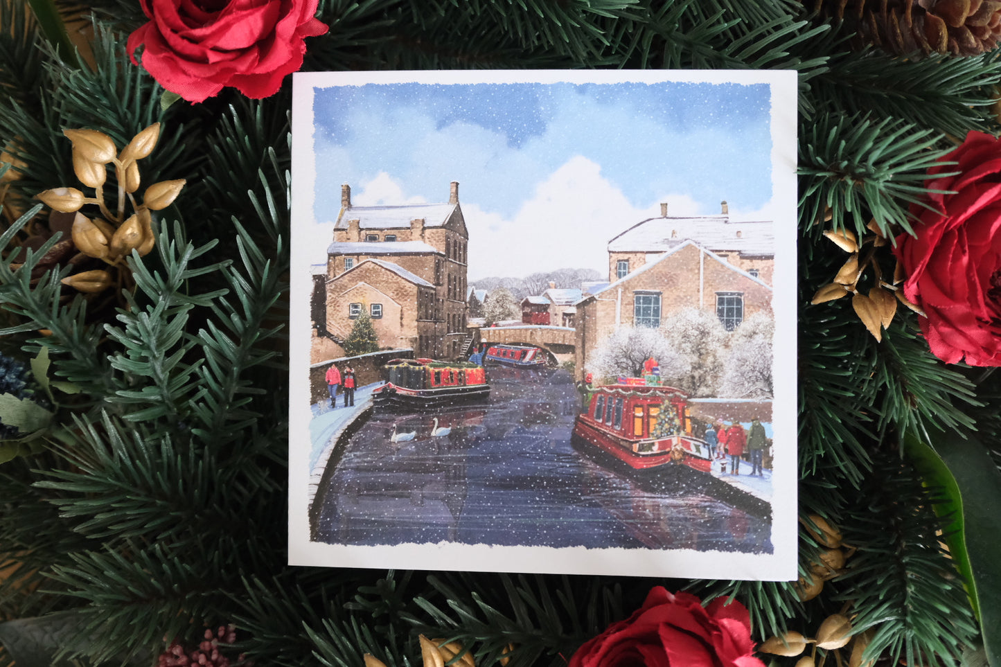 Christmas card depicting the canal scene in Skipton, surrounded by festive decorations