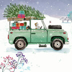Green vintage truck with Christmas tree and gifts in a snowy landscape