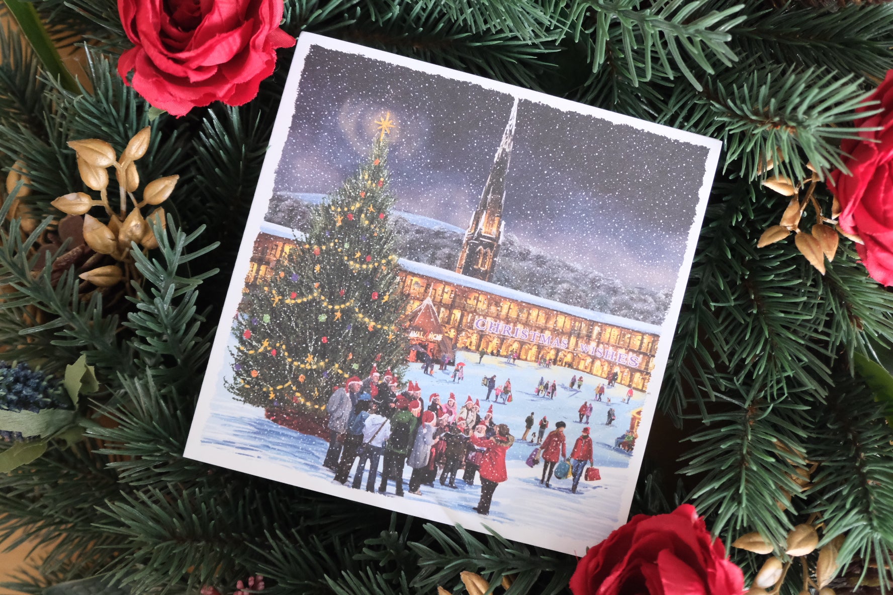 Christmas card showing a festive scene at Piece Hall, Halifax