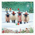 Sheep wearing winter hats and scarves in a snowy scene with Christmas decorations.